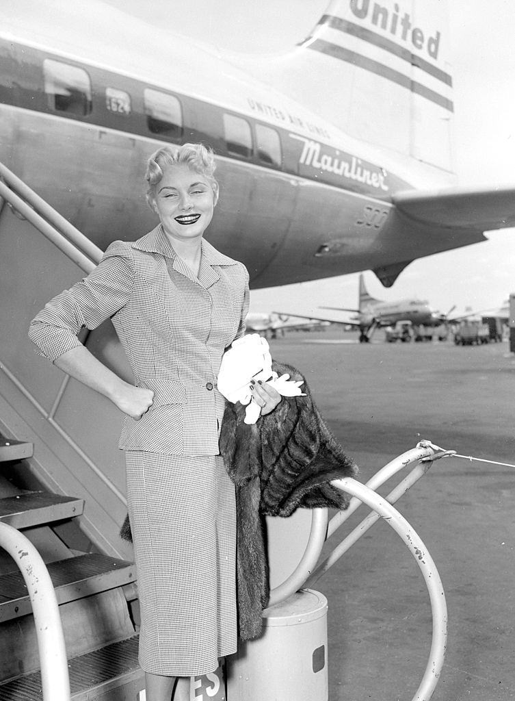 #24 Barbara Payton arrives at LaGuardia Airport, 1951.
