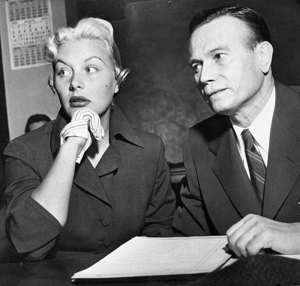 #34 Barbara Payton with her attorney Milton Golden, 1952.