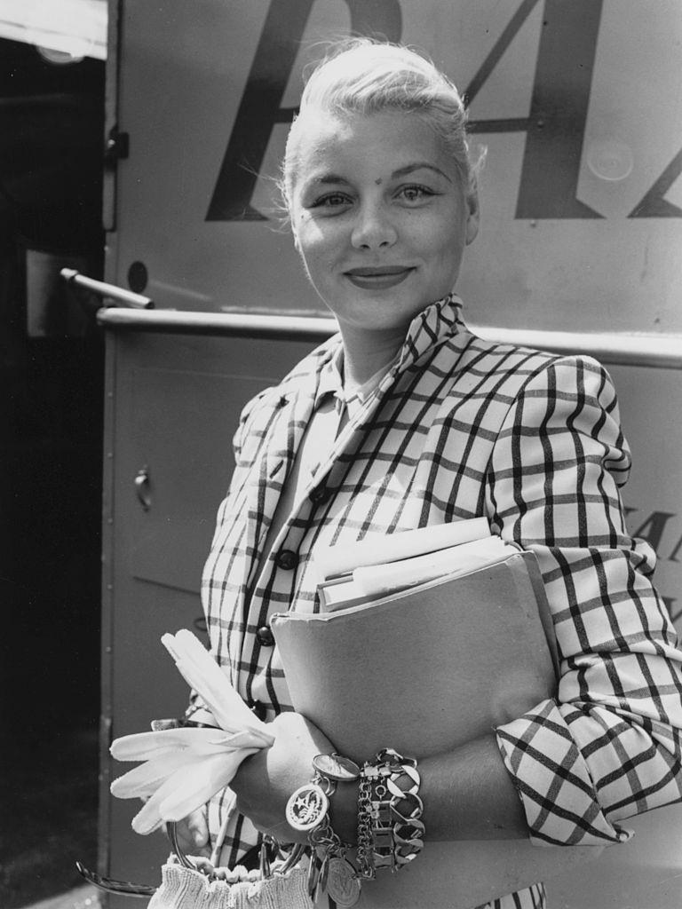 #37 Barbara Payton in the Britain to film ‘The Four Sided Triangle’, at London Airport, July 24th 1952.