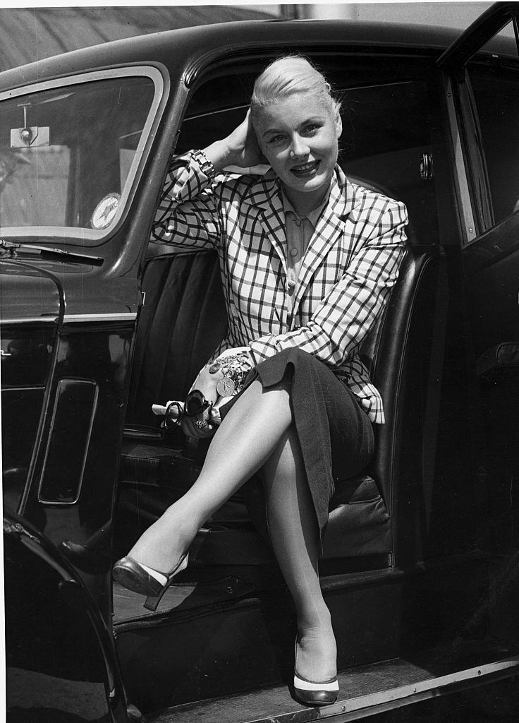 #41 Barbara Payton sitting in the car, 1952.