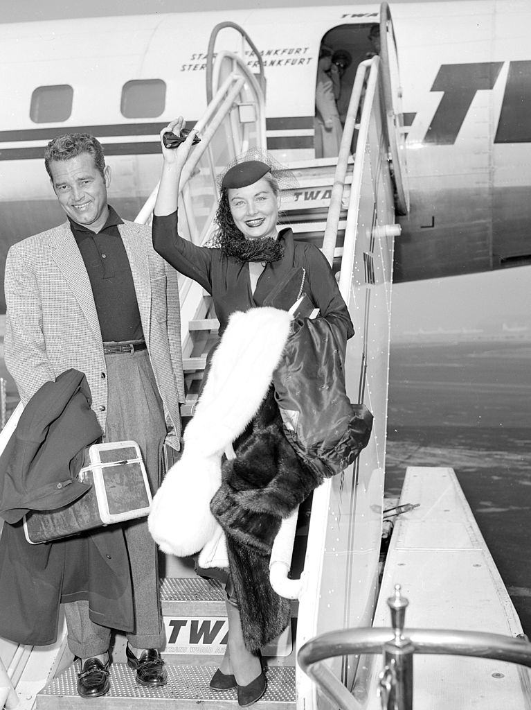 #53 Barbara Payton and Tom Neal arrives at Idlewild Airport, 1953.