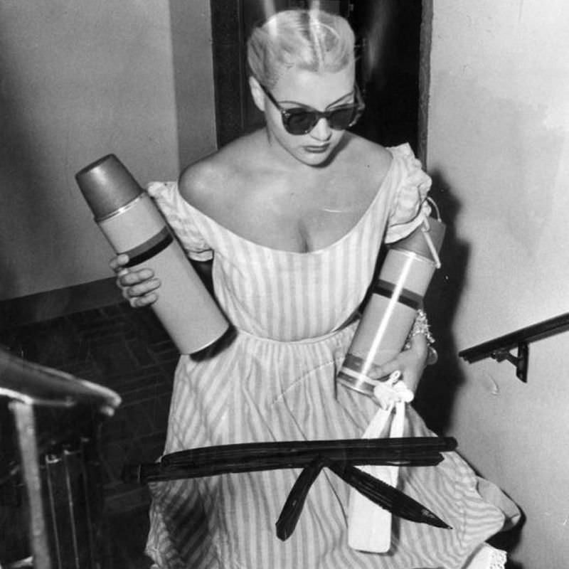 #56 Barbara Payton climbing the stairs of hospital, 1950.
