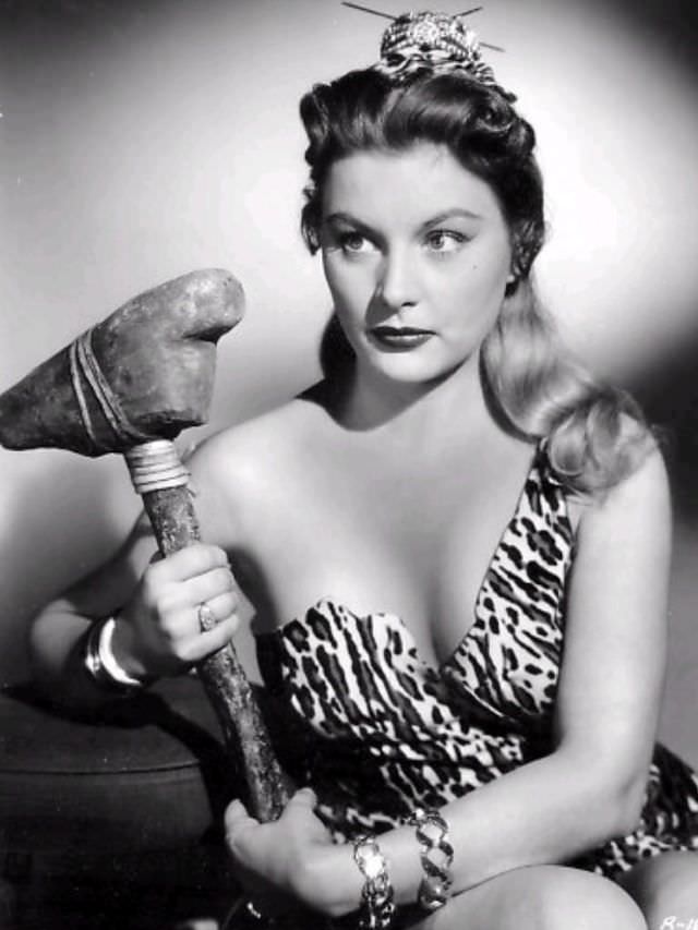 #63 Barbara Payton holding a hammer, 1950.