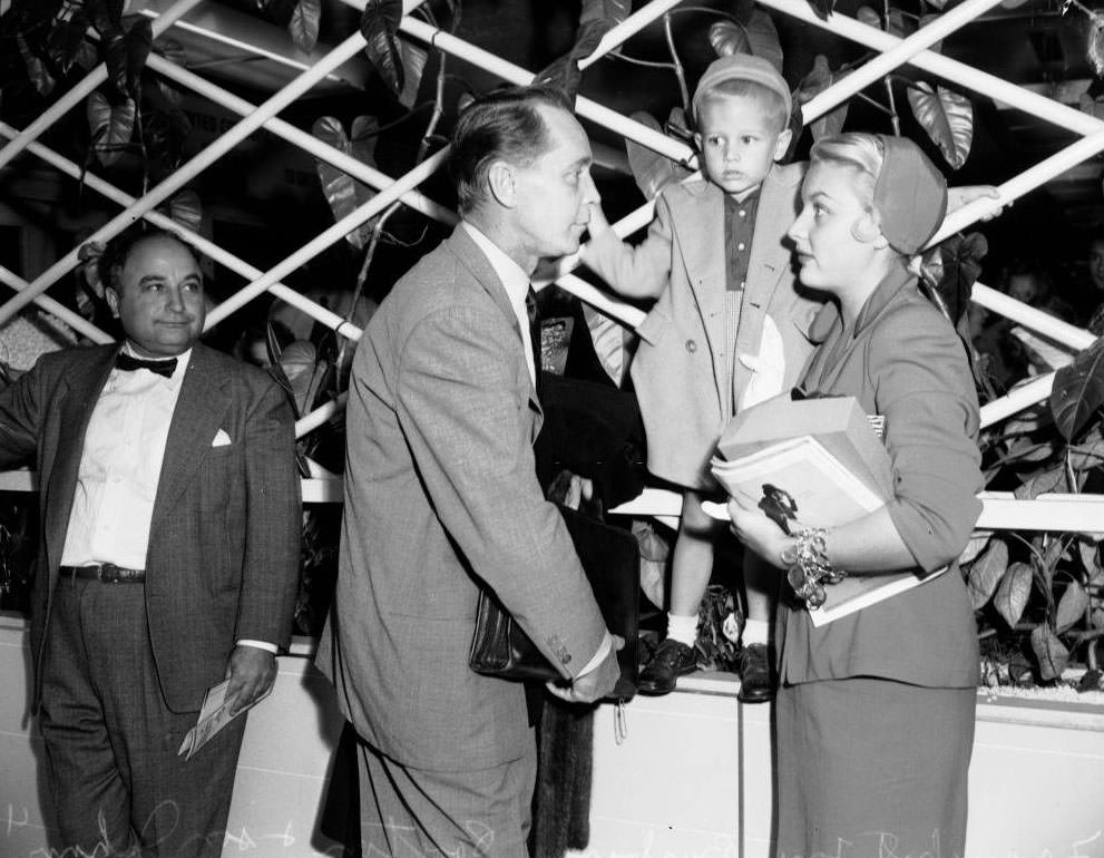 #12 Barbara Payton with Franchot Tone at the airport, 1951.