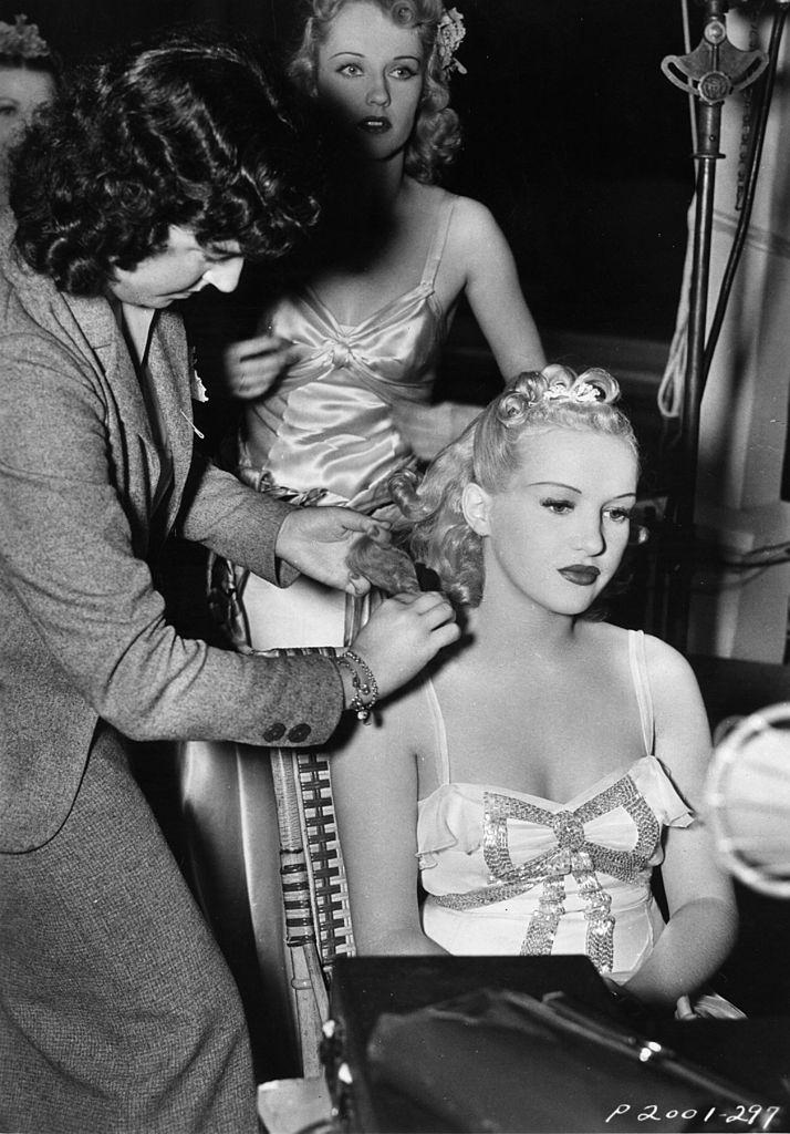 #20 Betty Grable being prepared prior to filming a scene, 1938.