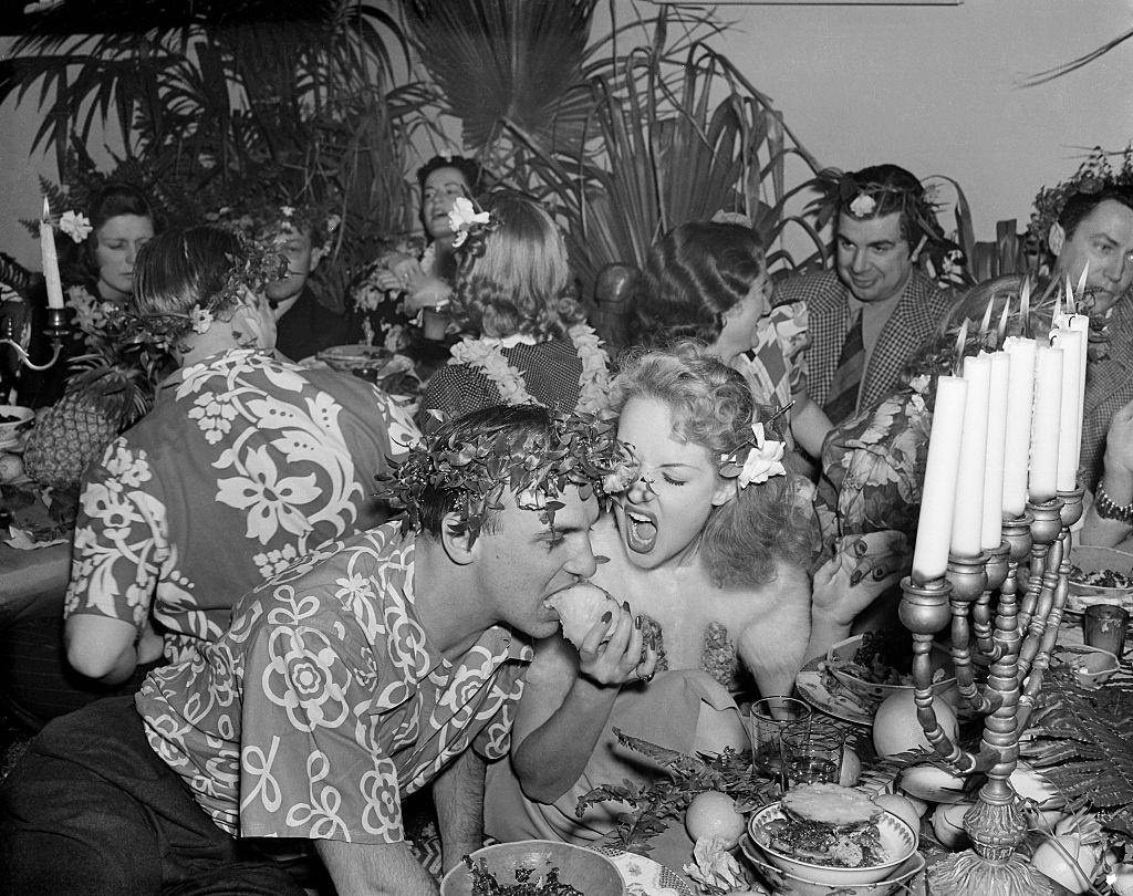 #22 Betty Grable feeding her husband in a show, 1938.