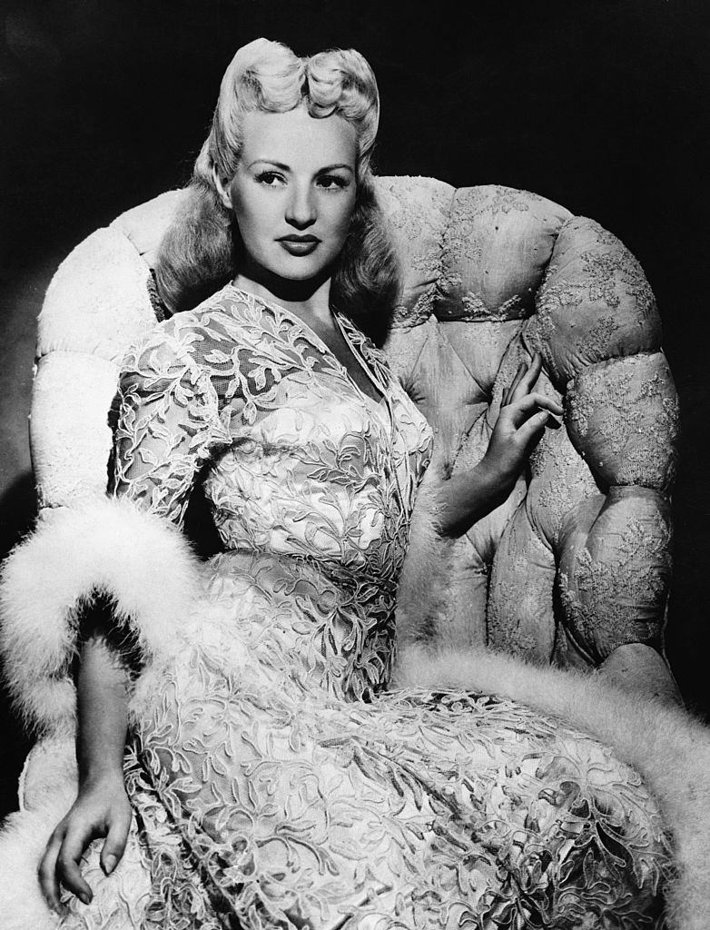 #65 Betty Grable posing on the sofa, 1944.