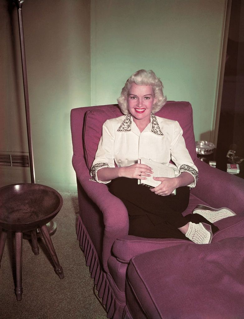 #48 Betty Grable Sitting in Chair, 1950.