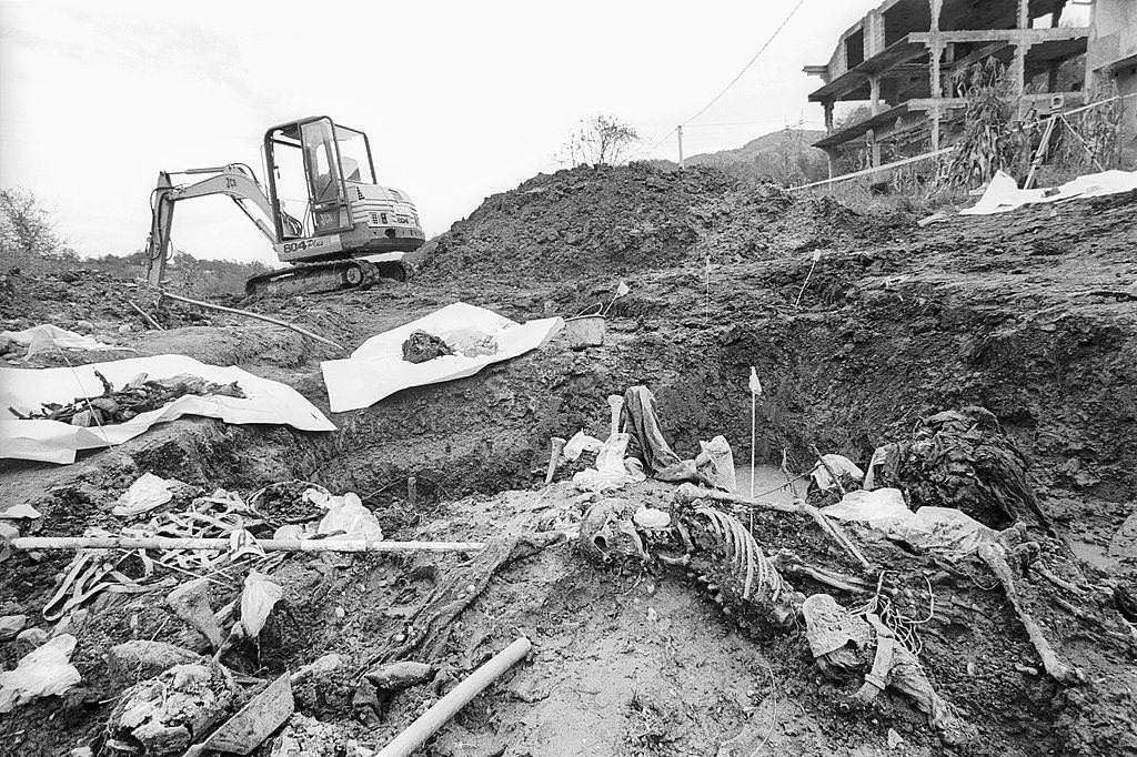 #2 A mass grave containing the bodies of men massacred in Srebrenica in July 1995.