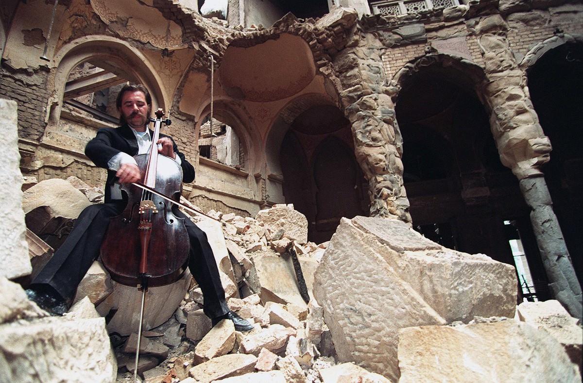 #15 During the Bosnian War, cellist Vedran Smailovic plays Strauss inside the bombed-out National Library in Sarajevo, on September 12, 1992