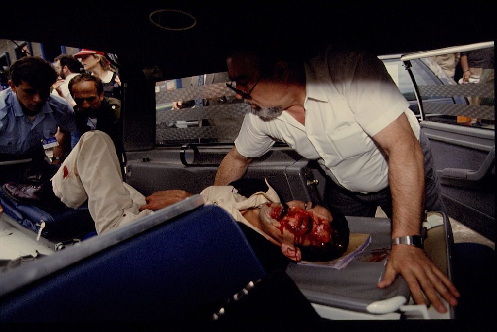 #8 An injured man being taken to the hospital.