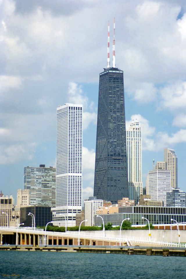 #19 The Water Tower place is the white skyscraper and the John Hancock Center is the tall dark skyscraper, taken from Navy Pier, Chicago, July 1996