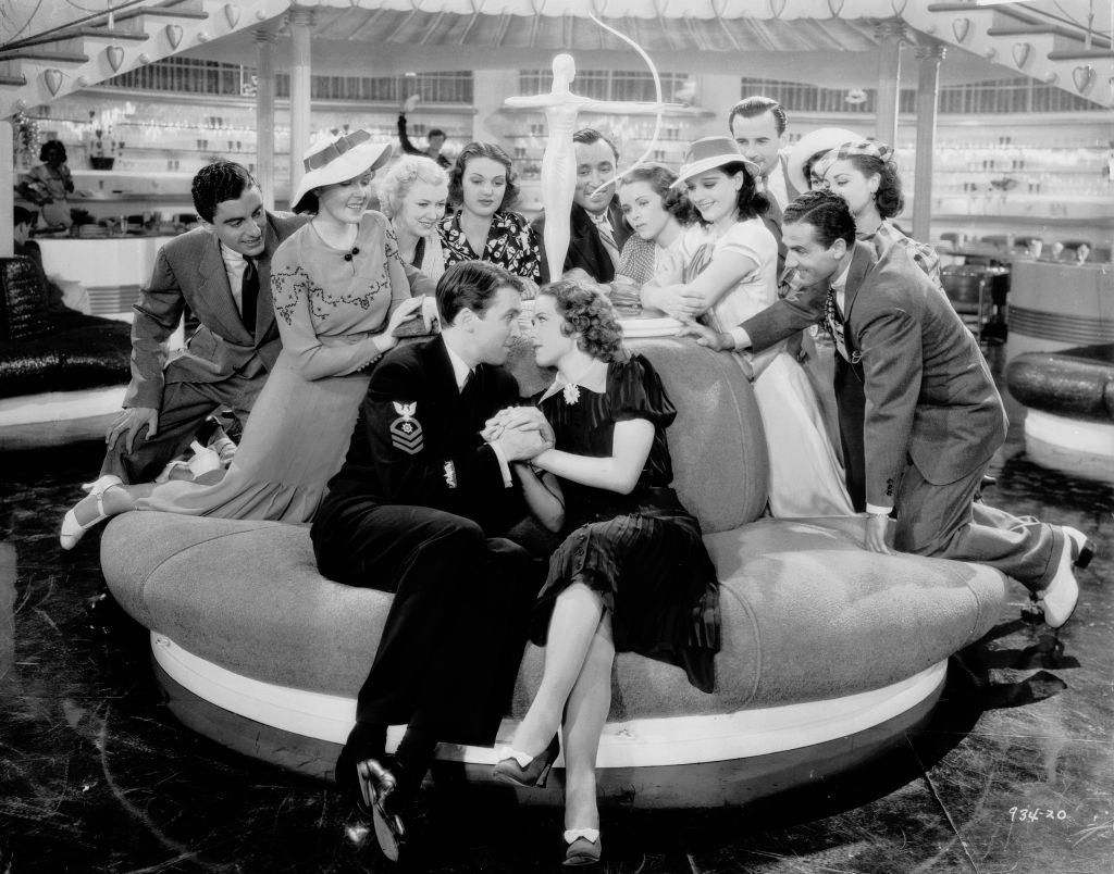 #26 Eleanor Powell and James Stewart attract a nosy crowd in a scene from the musical ‘Born To Dance’, 1936.