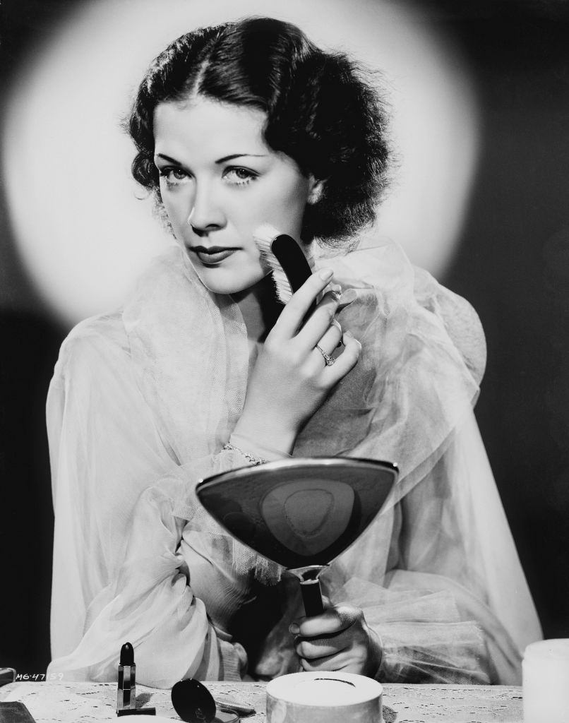 #39 Eleanor Powell applying the makeup on her face, 1935.