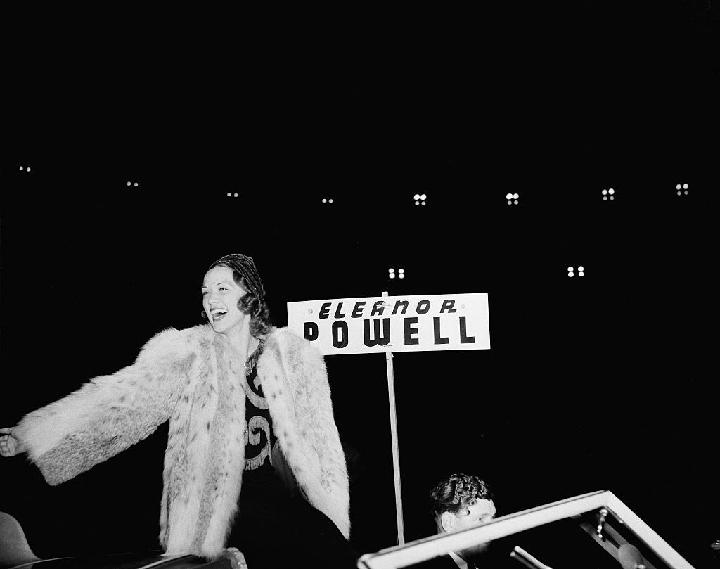 #13 Eleanor Powell greets fans during the Hollywood Chirstmas Parade in Los Angeles, 1940.