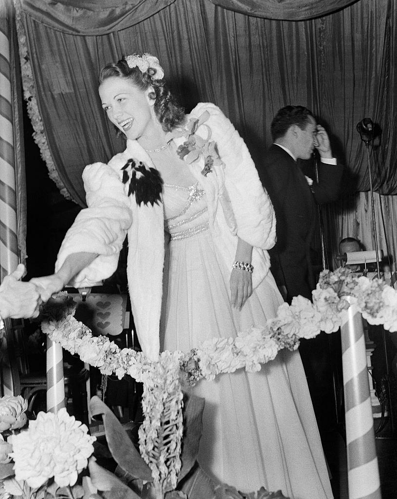 #47 Eleanor Powell greets fans during an event in Los Angeles, 1940.