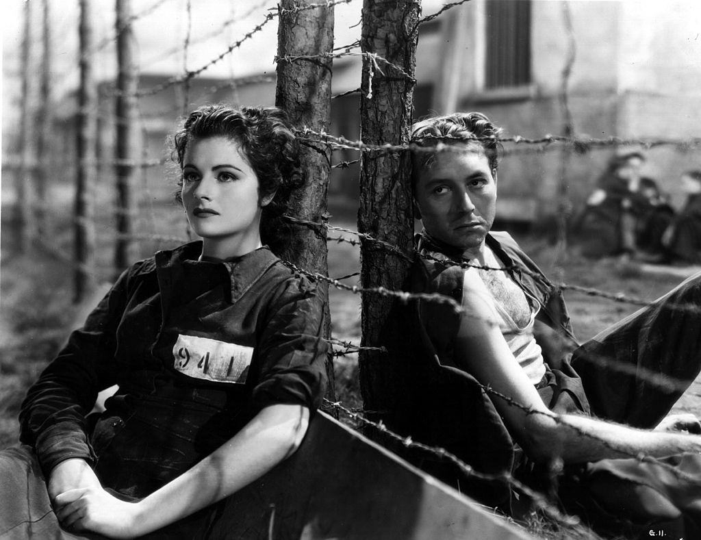#4 Margaret Lockwood as a prisoner-of-war with Paul Henreid in the movie ‘Gestapo’, 1940.