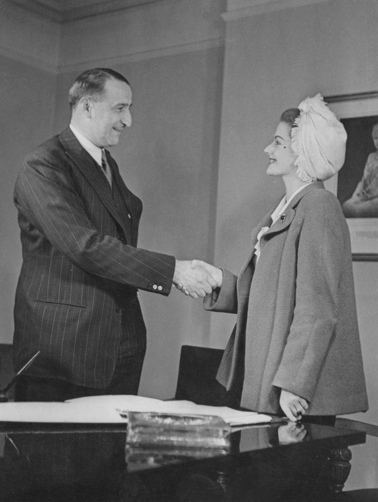 #29 Margaret Lockwood signs a six-year contract with Rank studio head J. Arthur Rank at his London office, 19th June 1946.