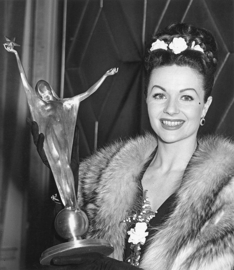 #43 Margaret Lockwood with her Silver Star award for Best British actress of 1946