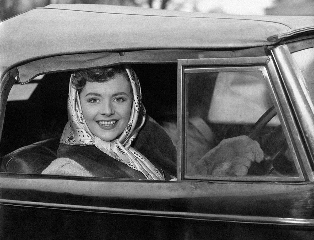 #59 Margaret Lockwood reaching Denham Film Studios on board her convertible, 1949.