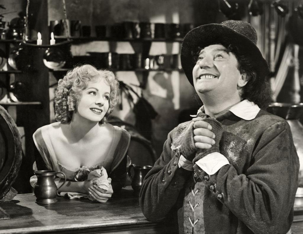 #61 Margaret Lockwood with d Sid Field as a Cromwellian barrow-boy, in a scene from the film “Cardboard Cavalier”, 1949.