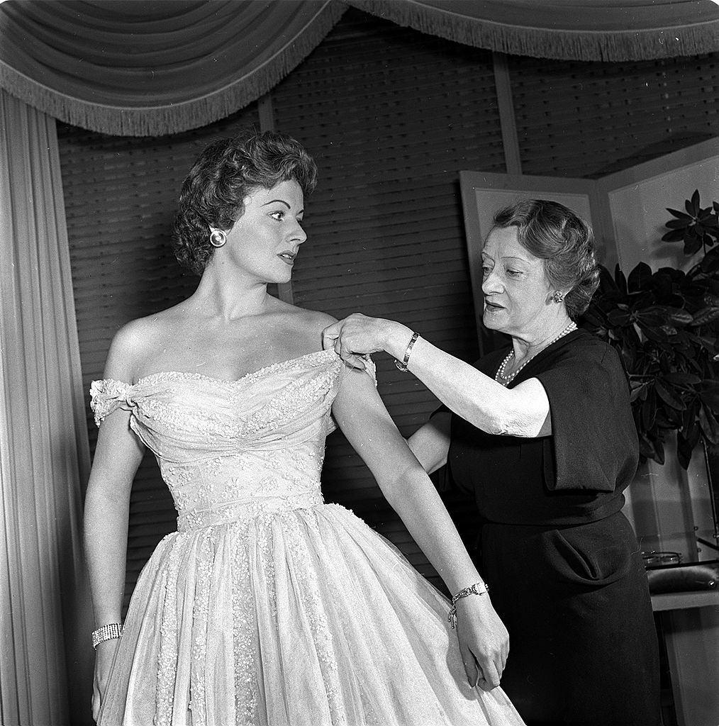 #65 Margaret Lockwood wearing a new gown for the Royal Command Performance, 1950.