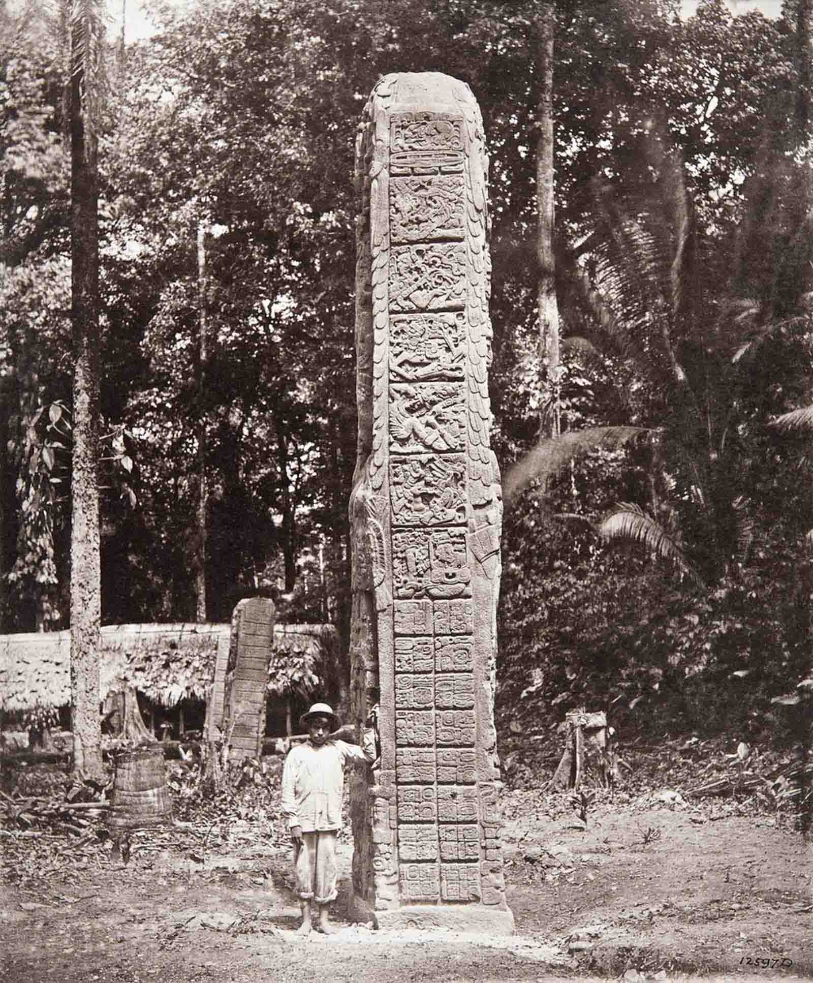 #16 Stela D (also known as Monument 4), dated AD 766. “The inscription on each side of the Stela is headed by an initial series of six squares of picture-writing”, Alfred Maudslay noted of this monument.