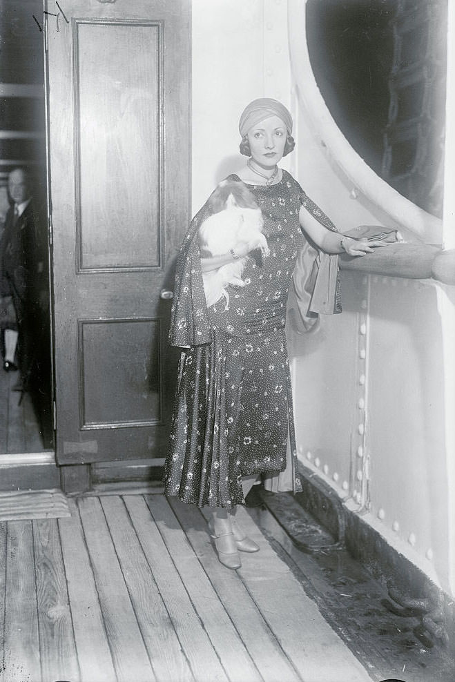#19 Natacha Rambova with her pet as she sailed on the S.S. Aquitania for Europe, 1929.