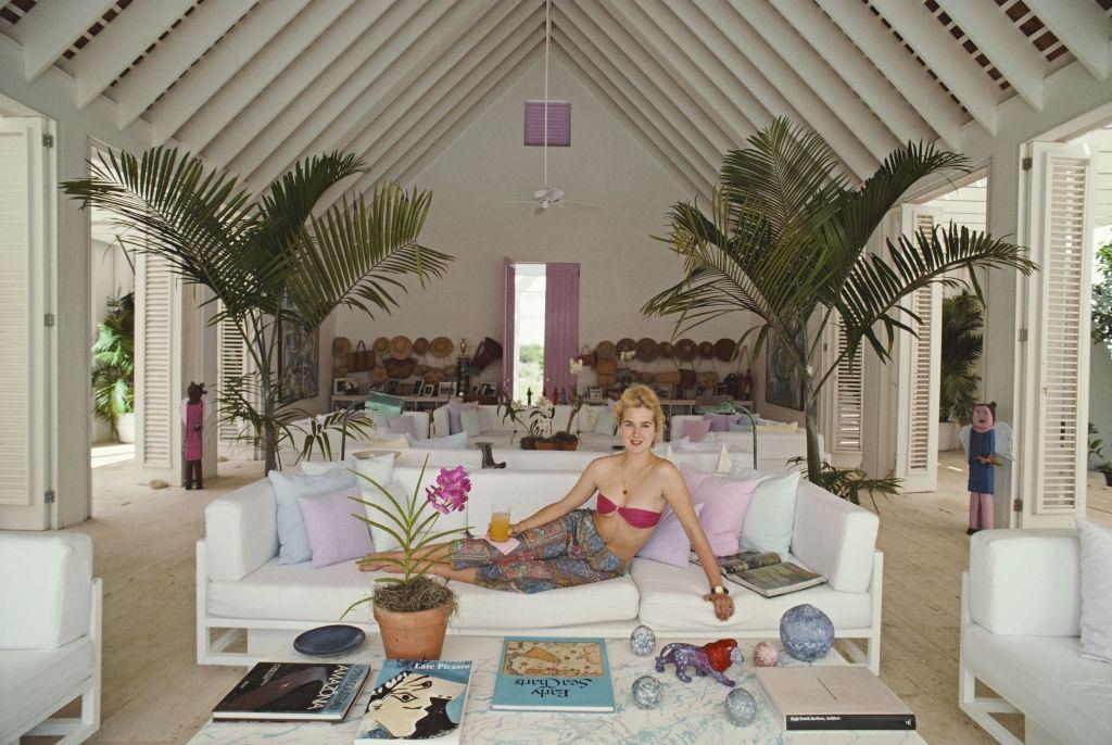 #15 Yale student Edith Hansel lying on a sofa, Casa de Campo, Dominican Republic, circa 1990