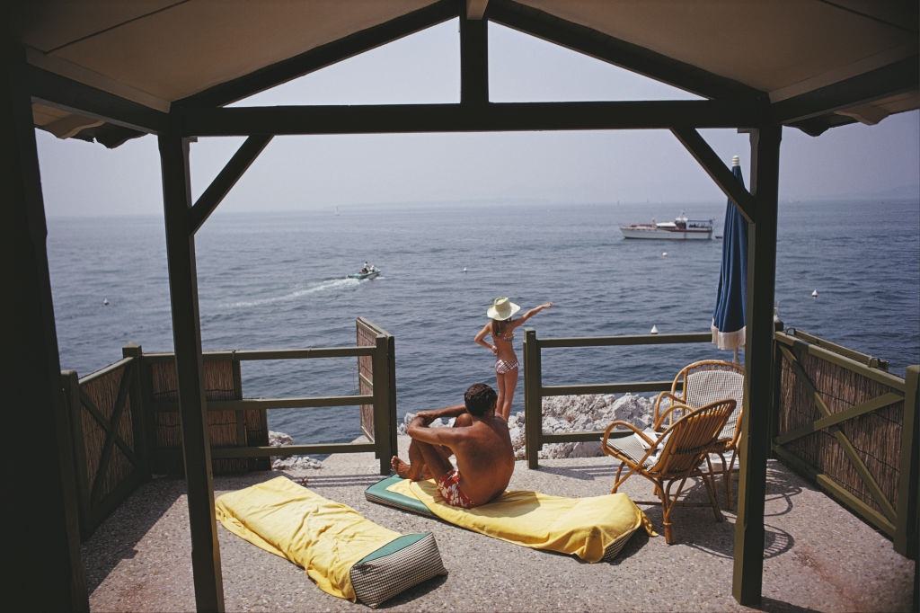 #18 Guests at a beach hut at the Hotel du Cap-Eden-Roc in Antibes on the French Riviera, August 1969