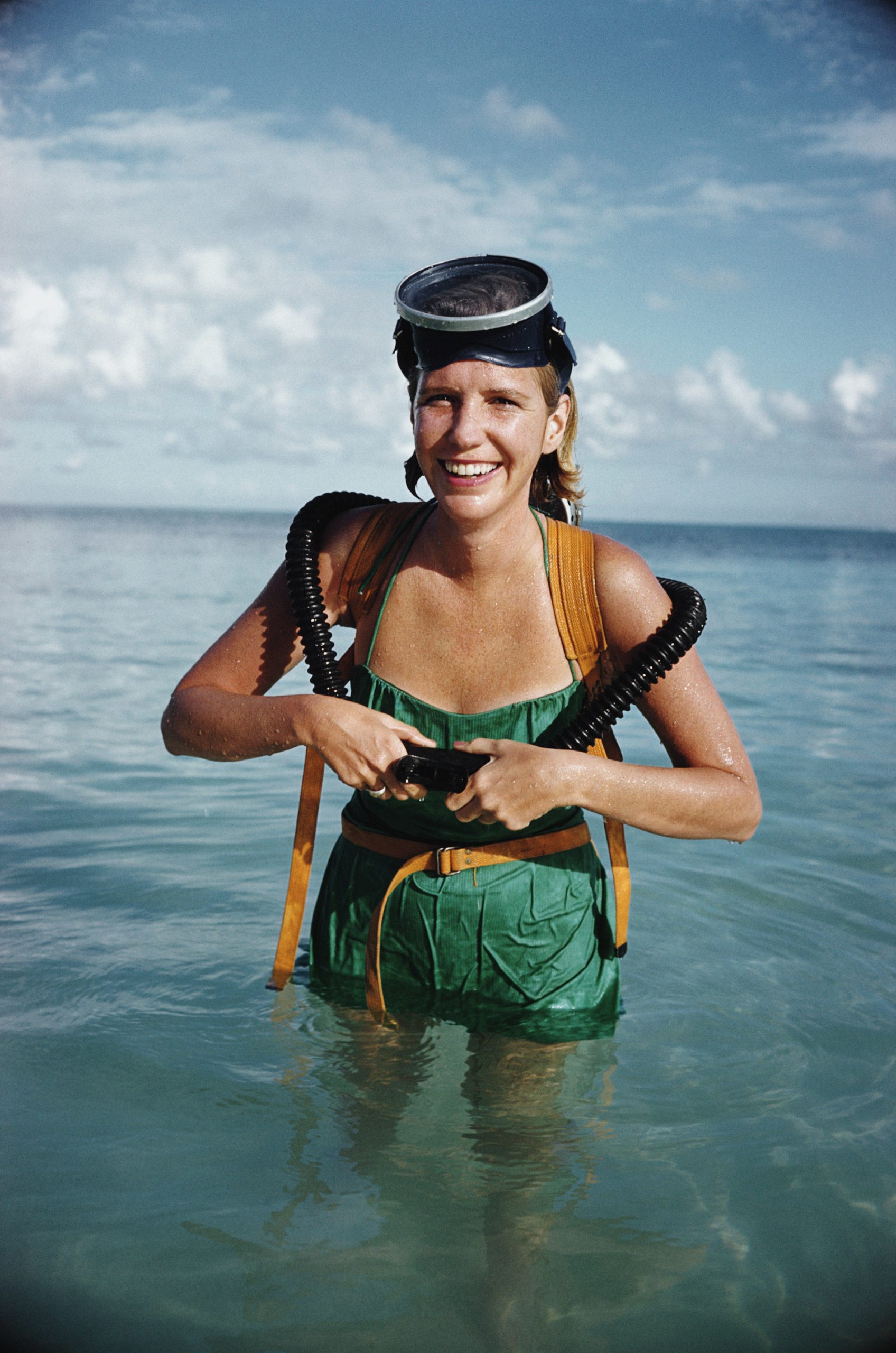 #8 A woman prepares to go snorkeling in Lyford Cay, Bahamas, March 1962.
