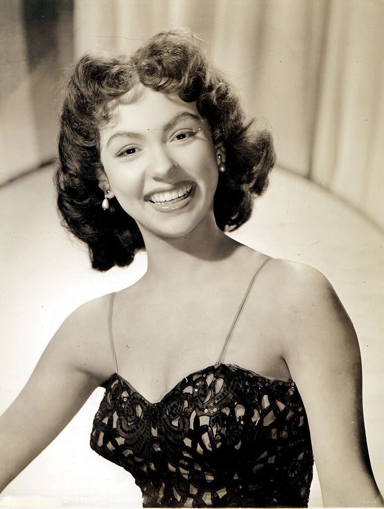 #18 Rita Moreno smiling, 1950.