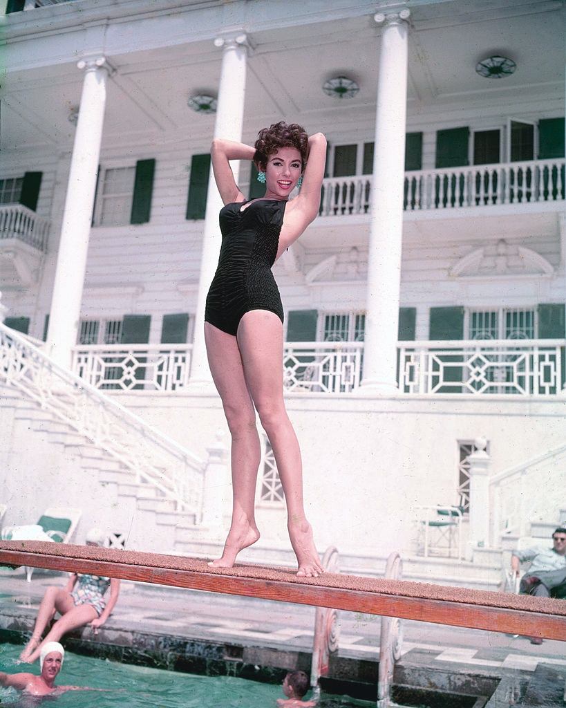#29 Rita Moreno in black swimsuit, 1955.