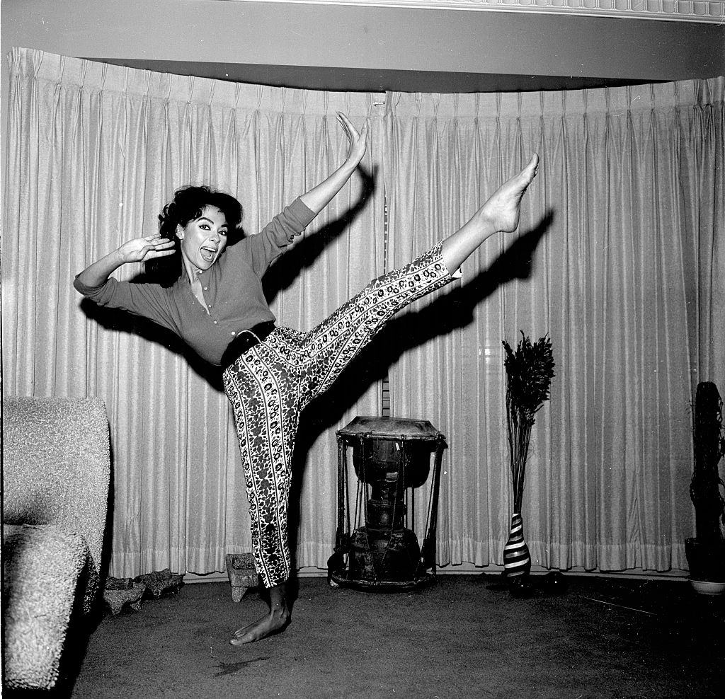 #46 Rita Moreno dancing in her home, 1957.