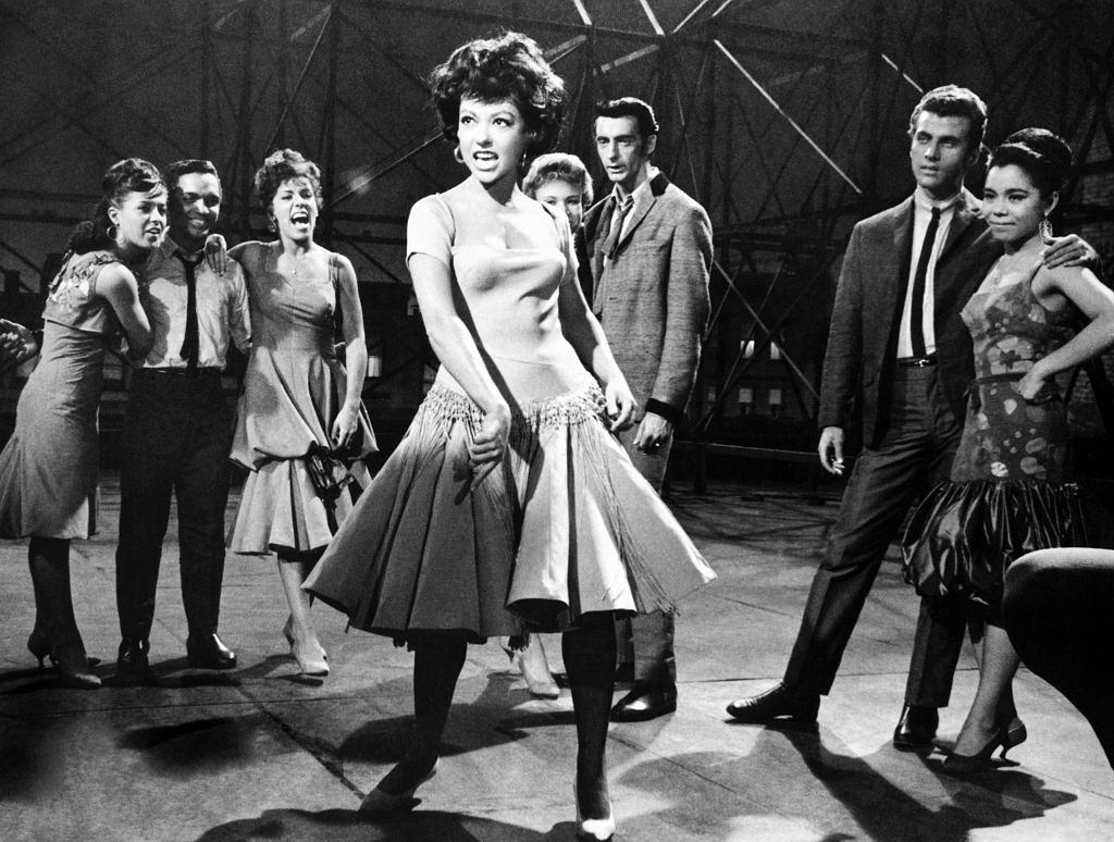 #53 Rita Moreno singing in a scene from the movie West Side Story, 1961.
