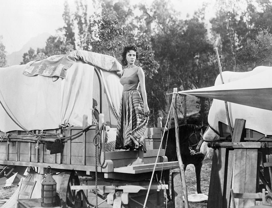 #8 Rita Moreno looking to her left outside in a scene from the film ‘Garden Of Evil’, 1954.