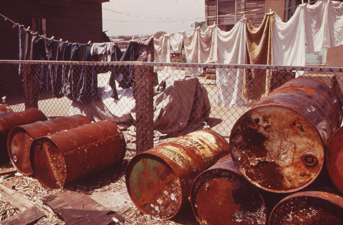 #25 Rusty Oil Cans Pile Up near Home in Broad Channel, a Jamaica Bay Community with Numerous Pollution Problems, 1973