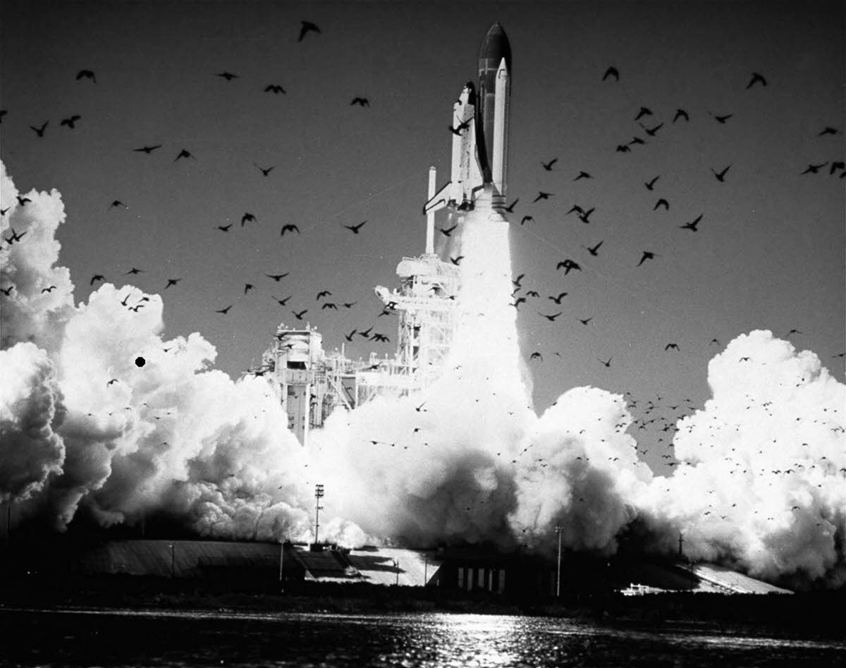 #2 The Challenger launches, moments before its destruction. Jan. 28, 1986.