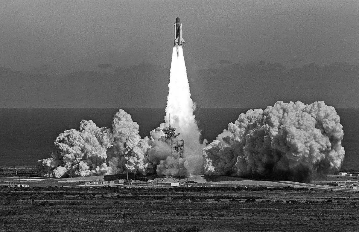 #11 The Challenger lifts off, approximately one minute before its catastrophic explosion.