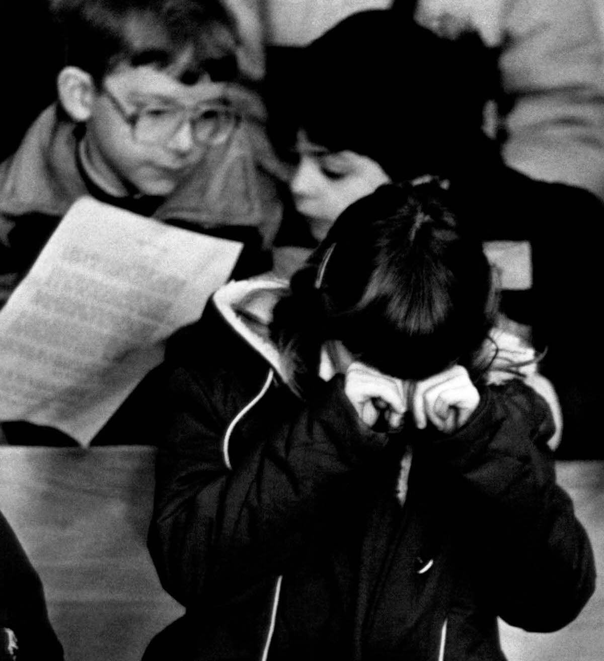 #21 A child cries during a memorial service for Christa McAuliffe at a church in Concord, New Hampshire.