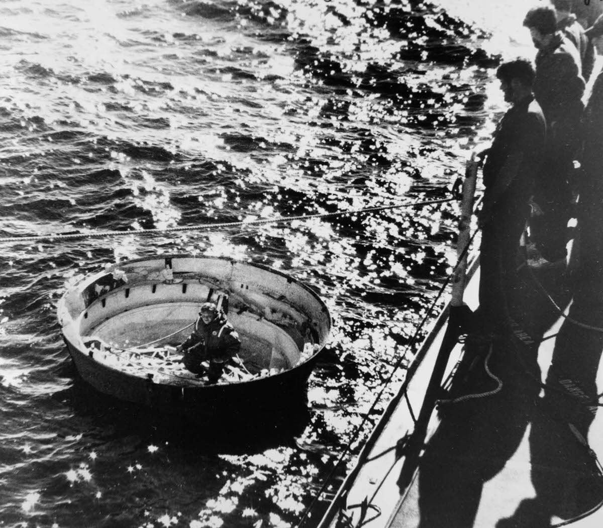 #23 Coast Guardsmen prepare to hoist the fulcrum of a solid rocket booster out of the ocean during Challenger salvage operations. Jan. 31, 1986.