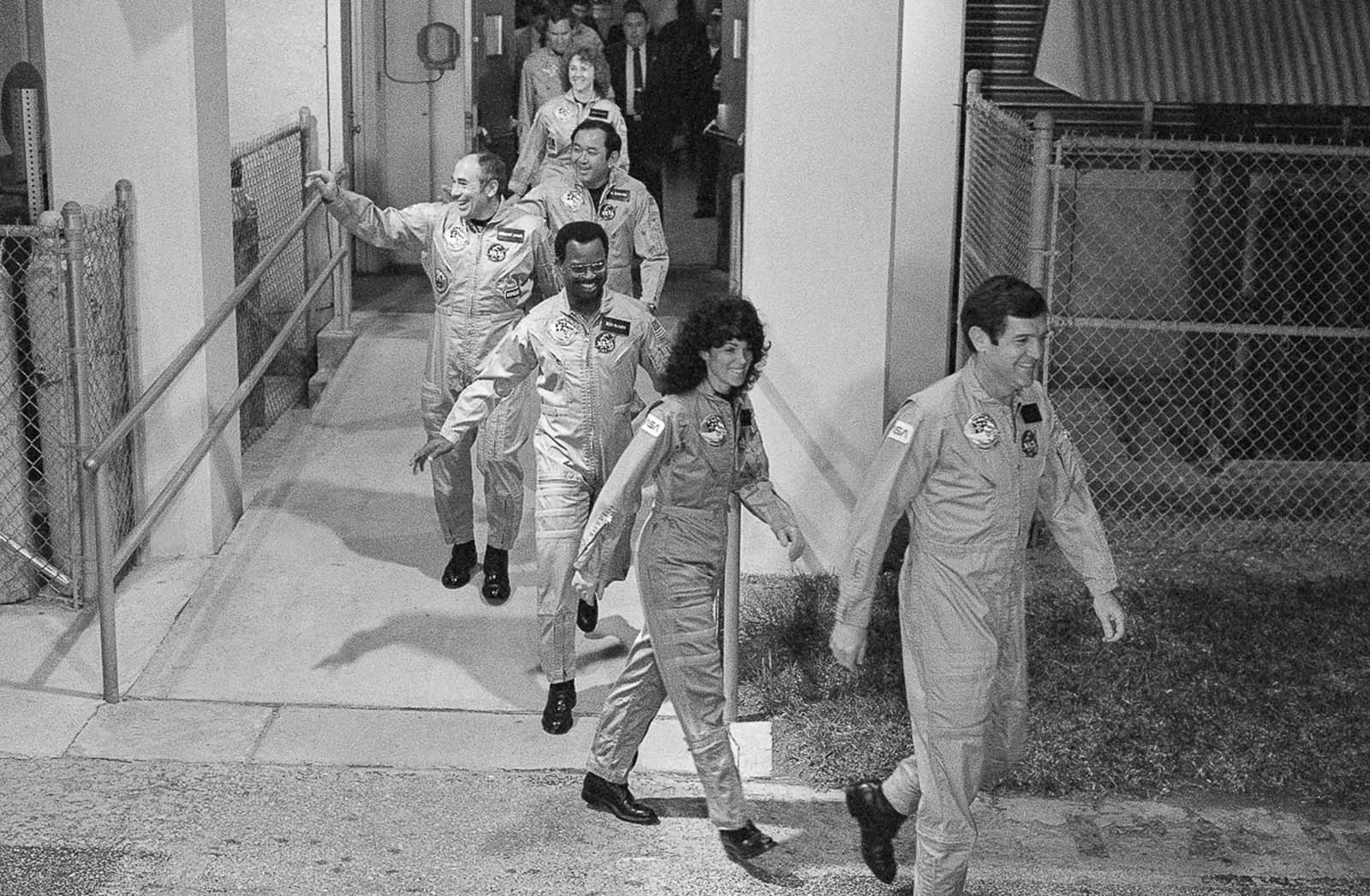 #9 The crew of the Challenger leave their quarters on their way to the launch pad. Jan. 27, 1986.