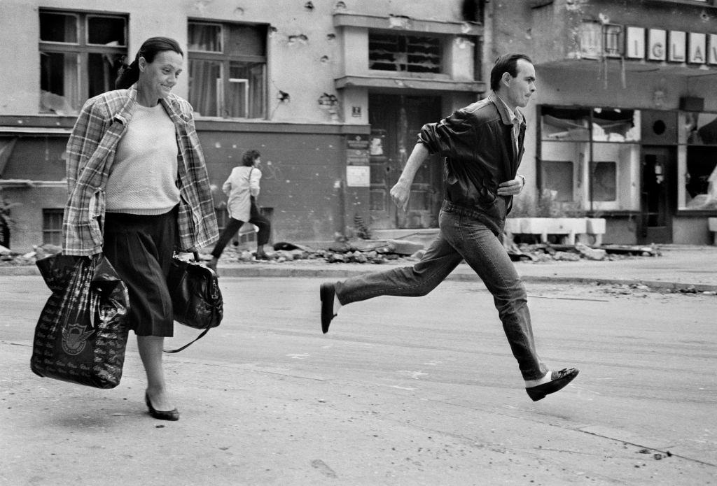 Citizens sprint across ‘Sniper Alley’ during the siege of Sarajevo in 1994.