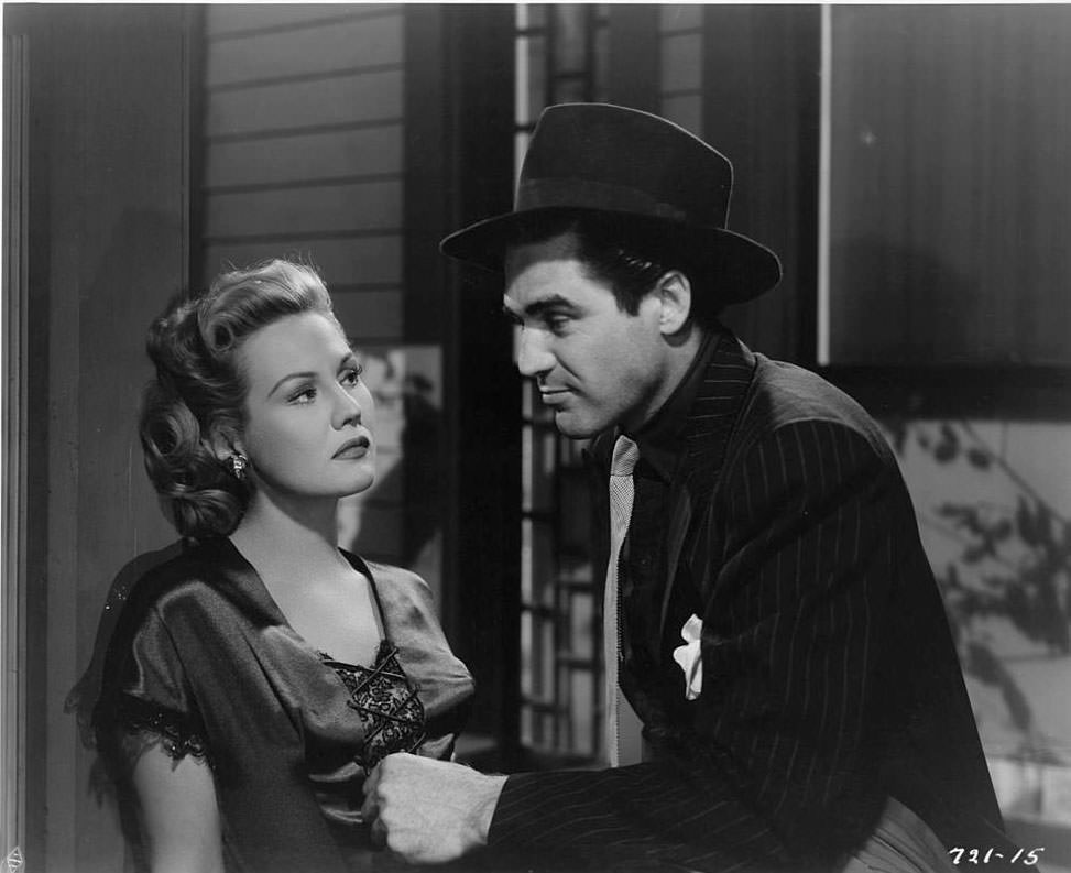 #20 Virginia Mayo looking at Steve Cochran in a scene from the film ‘White Heat’, 1949.
