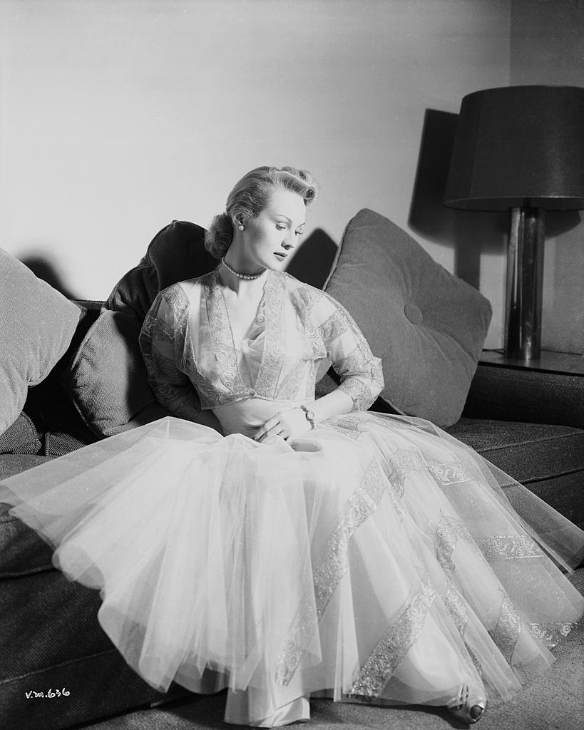 #60 Virginia Mayo wearing an evening dress of layered gauze, 1950.