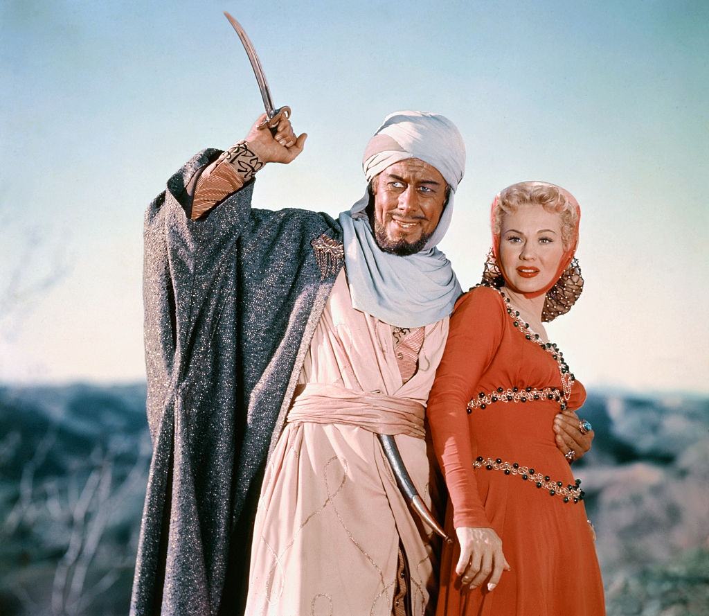 #49 Virginia Mayo with Rex Harrison in the movie ‘King Richard and the Crusaders’, 1947.