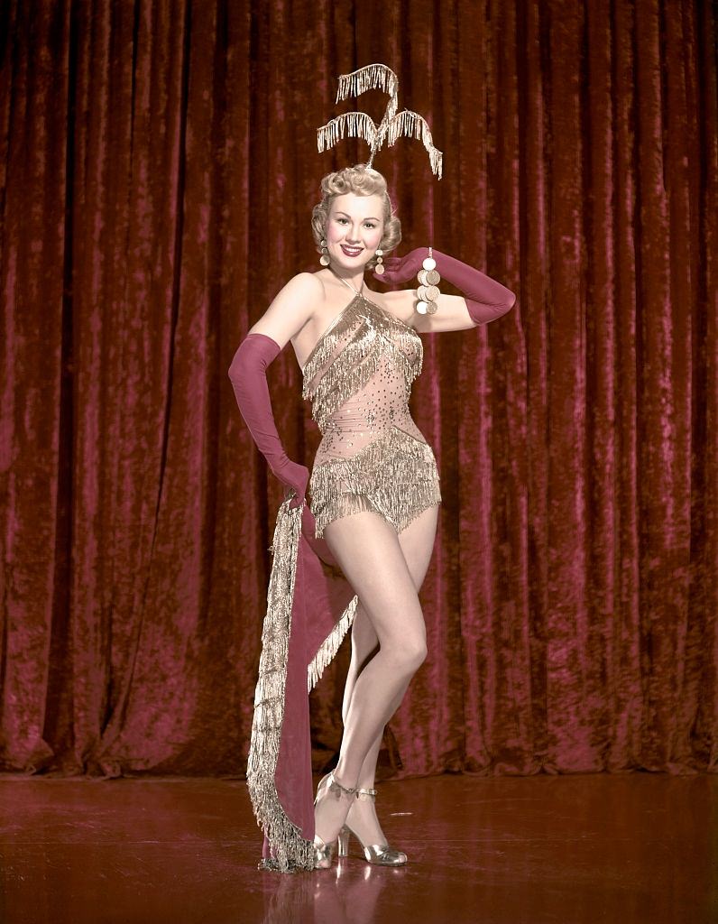 #52 Virginia Mayo on the set of ‘She’s Working Her Way Through College’, 1952.