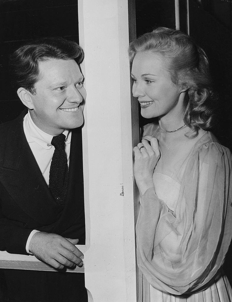 #56 Virginia Mayo with Michael O’Sheaposing for pictures on their wedding day, at the Little Church of the Flowers, Hollywood, 1947.