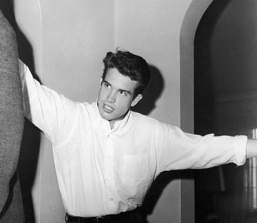 #10 Warren Beatty wears a white button-down shirt in his apartment, 1955.