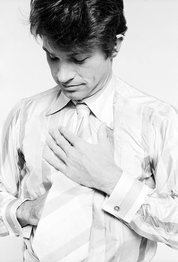 #70 Warren Beatty as he knots his necktie, 1960s